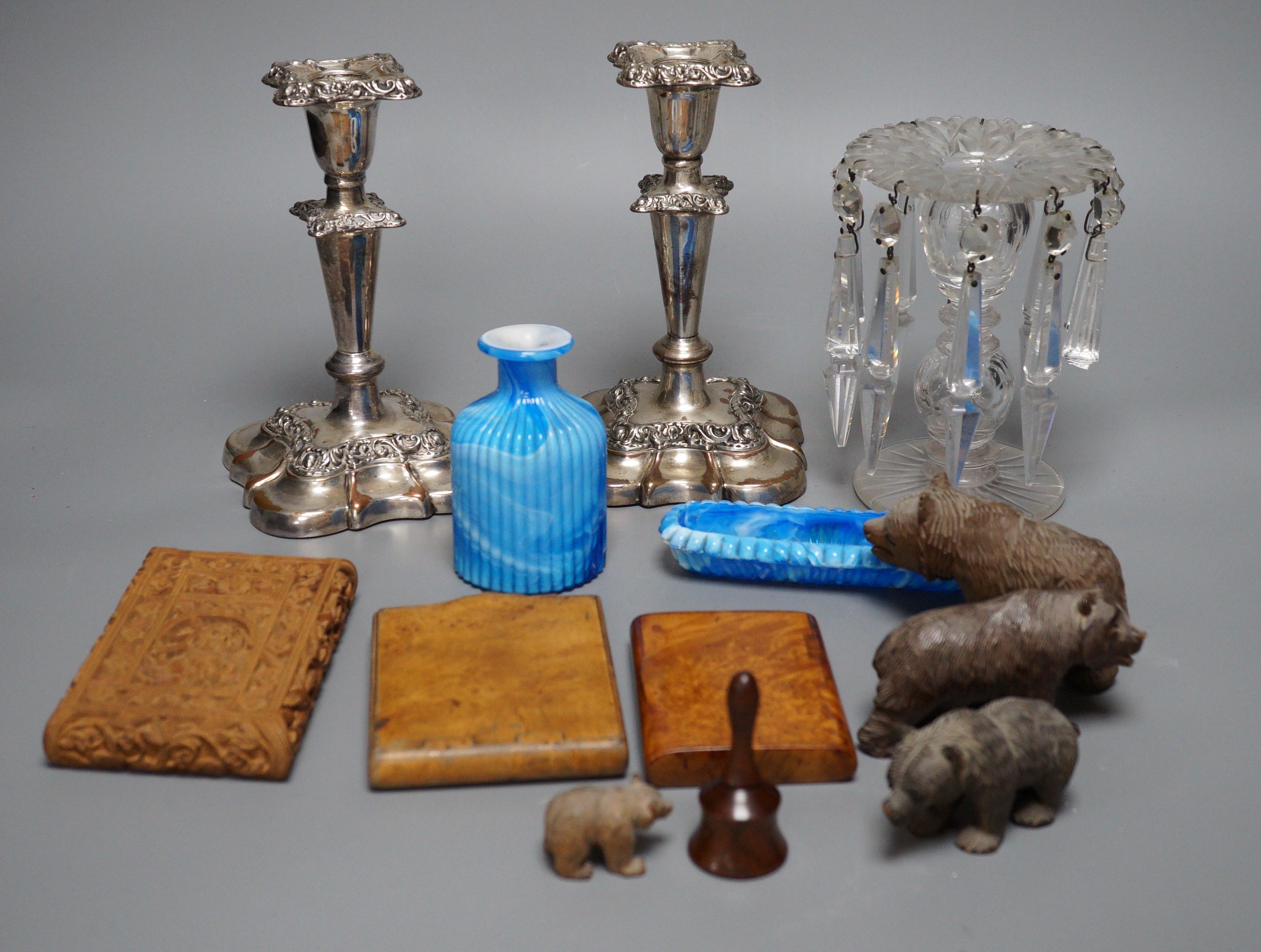 Four Black Forest carved wood bears, a Victorian glass table lustre, two coloured slag glass items, etc.